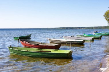 Colorful boats in summer, Naroch- largest lake in Belarus clipart