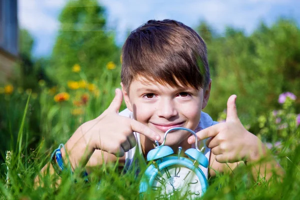 Boy Alarm Clock Lays Summer Garden — Stock Photo, Image