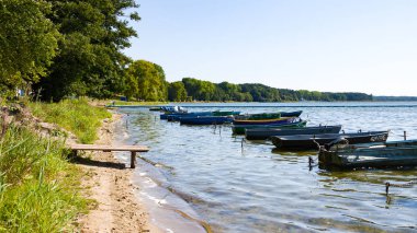 Naroch, Belarus - August 23, 2018: Colorful boats in summer, Naroch- largest lake clipart