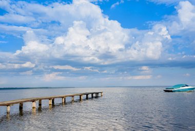 Panoramic sky over Naroch lake and pier. Belorussia clipart