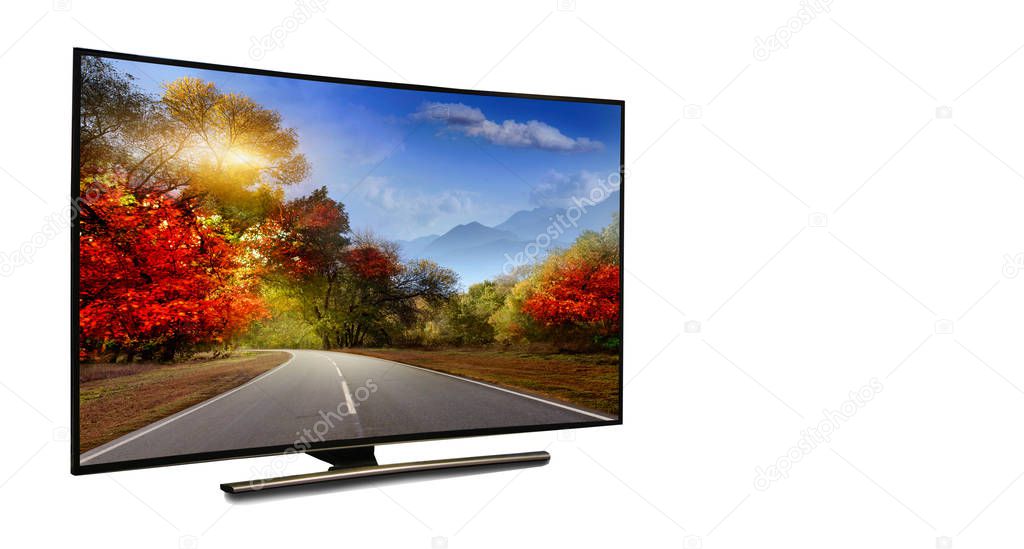 4k monitor isolated on white.  The road is rural, unpaved in the steppes at sunset. Modern, elegant TV 4 K, with incredibly beautiful colors of the image.