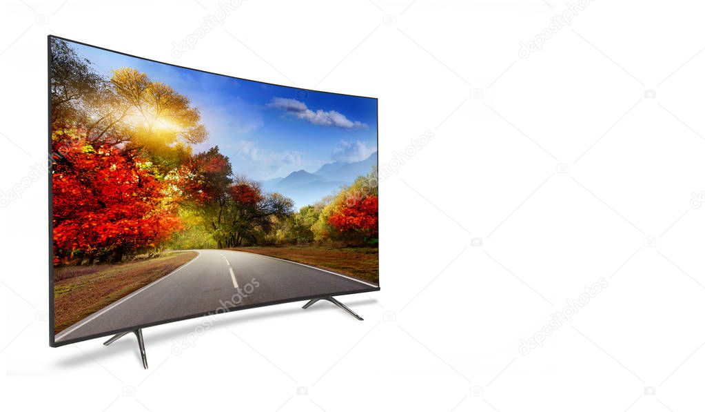 4k monitor isolated on white.  The road is rural, unpaved in the steppes at sunset. Modern, elegant TV 4 K, with incredibly beautiful colors of the image.