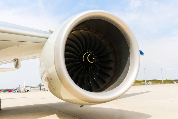 A Engine of modern passenger jet airplane. Rotating fan and turbine blades.