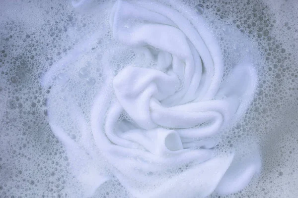 Soak a cloth before washing, white cloth