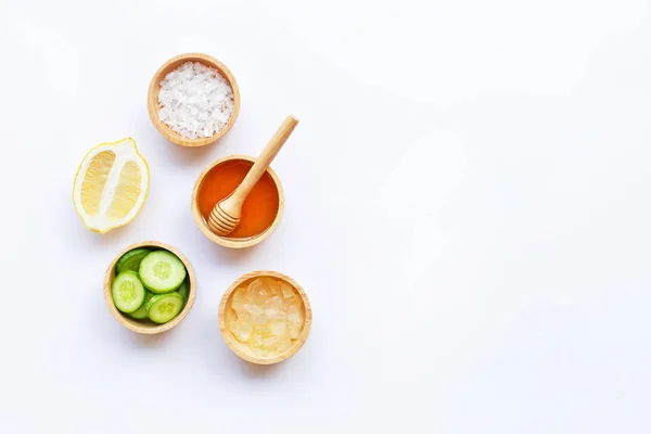 Aloe vera, lemon, cucumber, salt, honey. Natural ingredients for homemade skin care on white background. Copy space