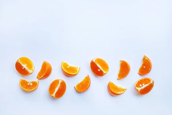 Slices of orange or tangerine isolated on white background. Copy space