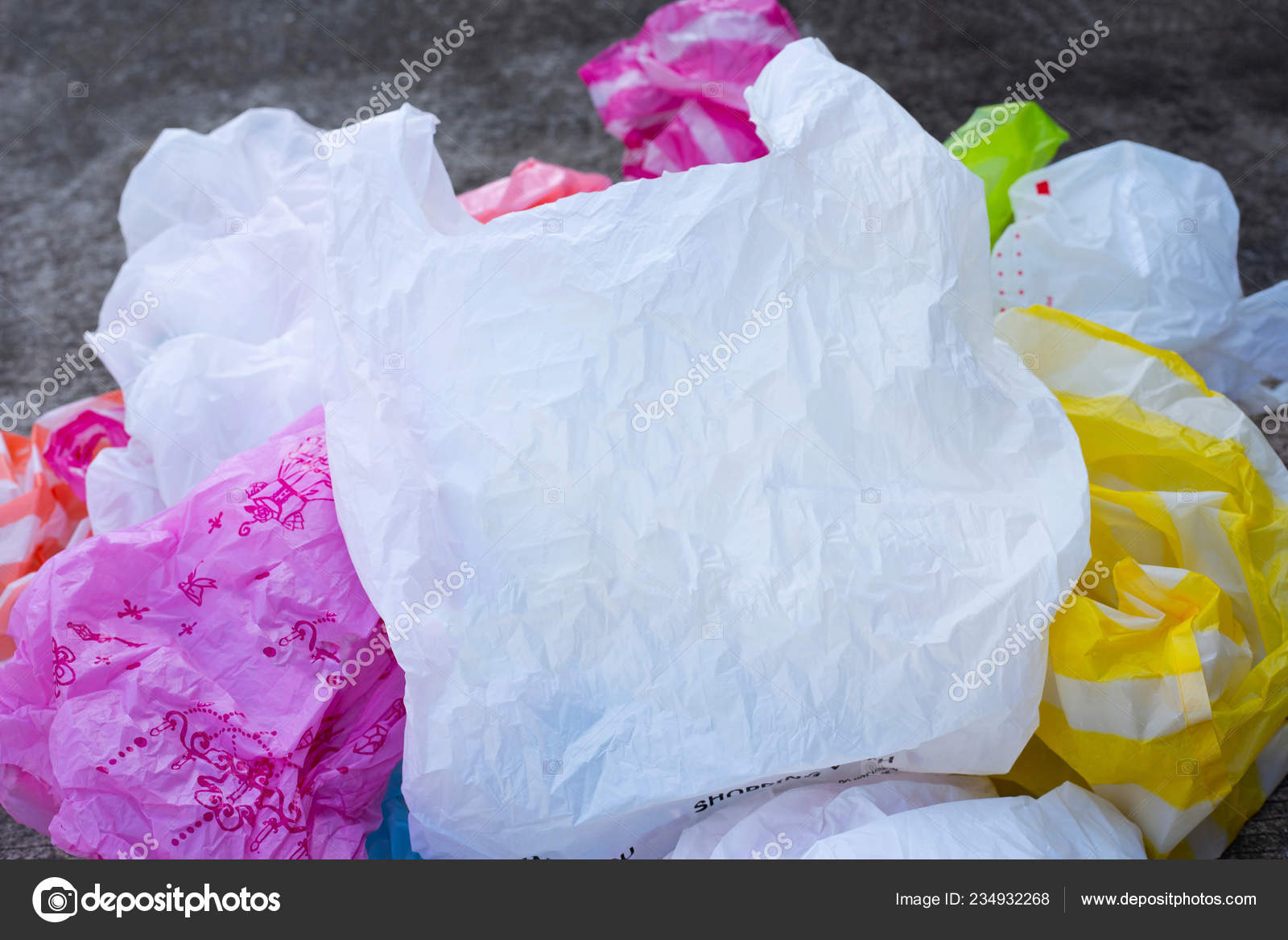 Colorful Plastic Bags Cement Floor Background Stock Photo