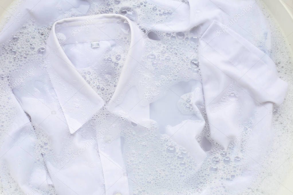 Soak a cloth before washing, white shirt