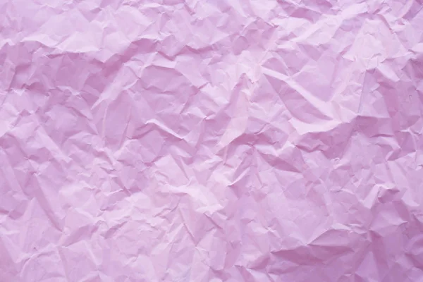 Pink crumpled recycle paper background