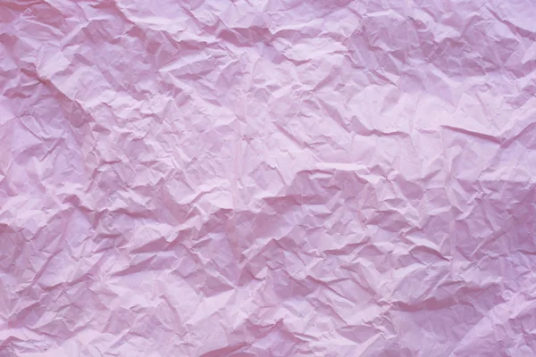 Pink crumpled recycle paper background