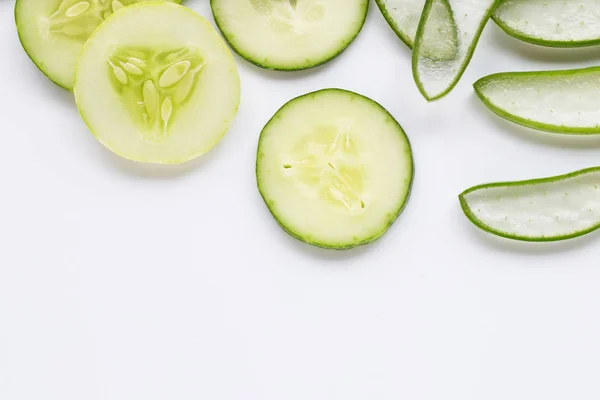 Aloe vera and cucumbers isolated on white.