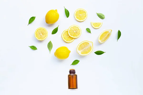 Lemon and slices with  essential oil isolated on white — Stock Photo, Image