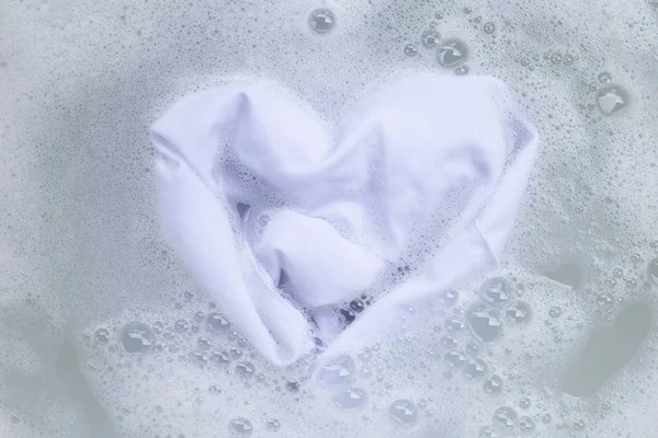 Soak a cloth before washing, white cloth