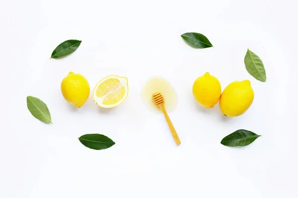 Limón fresco con miel sobre blanco — Foto de Stock