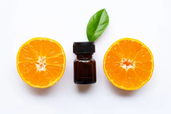 Essential oil with fresh orange citrus fruit on white — Stock Photo, Image