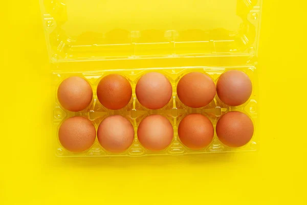 Eggs on yellow background. — Stock Photo, Image