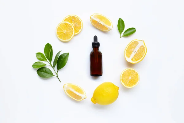 Fresh lemon with lemon essential oil on white. — Stock Photo, Image