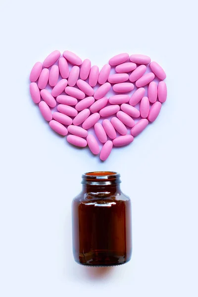 Pastillas de medicina rosa sobre fondo blanco . —  Fotos de Stock