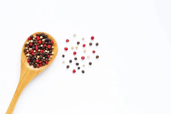 Black, red and white peppercorns on white — Stock Photo, Image