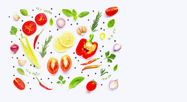 Various fresh vegetables and herbs on over white background. Hea