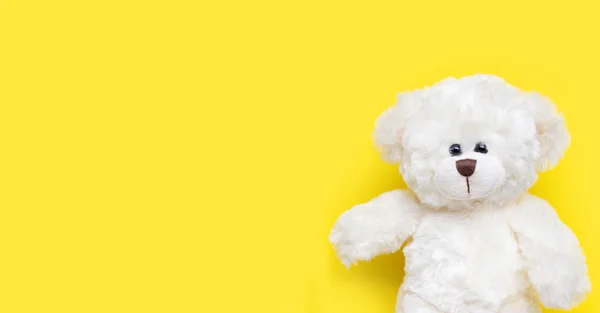 Toy white bear on yellow background. — Stok Foto