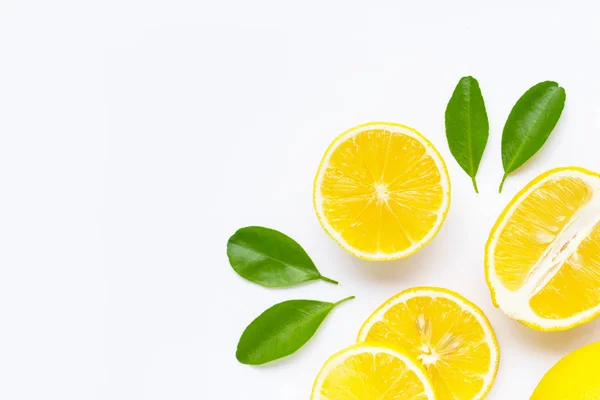 Lemon and slices with leaves isolated on white. — Stock Photo, Image