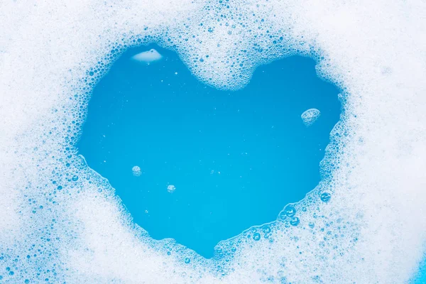 Frame made of detergent foam bubble. heart shape