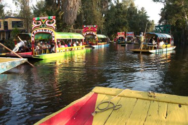 Xochimilco, Mexico City, Mexico - 2019: Trajinera boats fulll of people on a weekend.