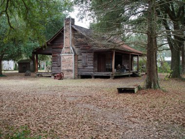 Baton Rouge, Louisiana, USA - 2019: A cabin at LSU Rural Life Museum, an outdoor museum of Louisiana history. clipart