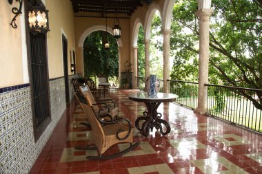 Tecoh, Yucatan, Mexico - 2019: A historic house, the former family home at Hacienda Sotuta de Peon, where traditional henequen plant (Agave fourcroydes) manufacturing is performed as demonstration. clipart