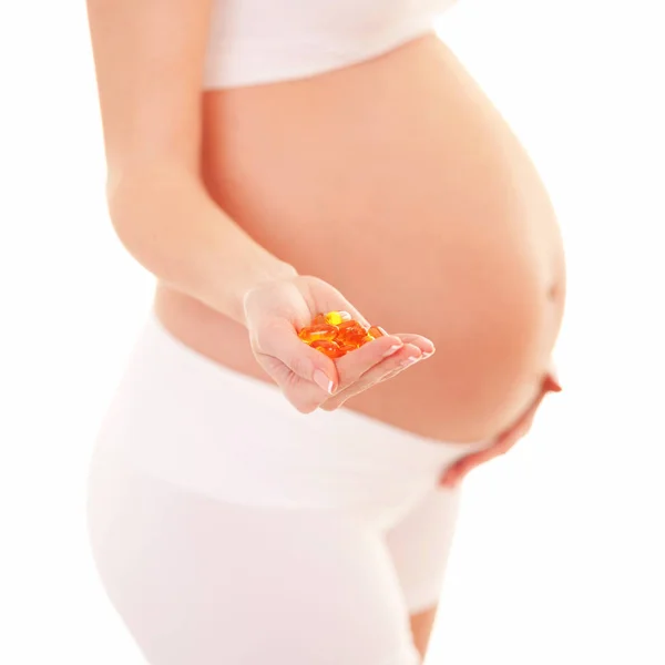 Mulher Grávida Segurando Pílulas Isoladas Fundo Branco Nutrição Dieta Durante — Fotografia de Stock