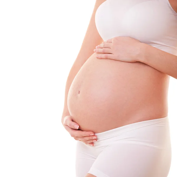 Beeld van een zwangere vrouw die haar dikke buik aanraakt. Sluit maar af. Moederschap, zwangerschap, mensen en verwachtingen. Zwangere vrouw verwacht baby — Stockfoto