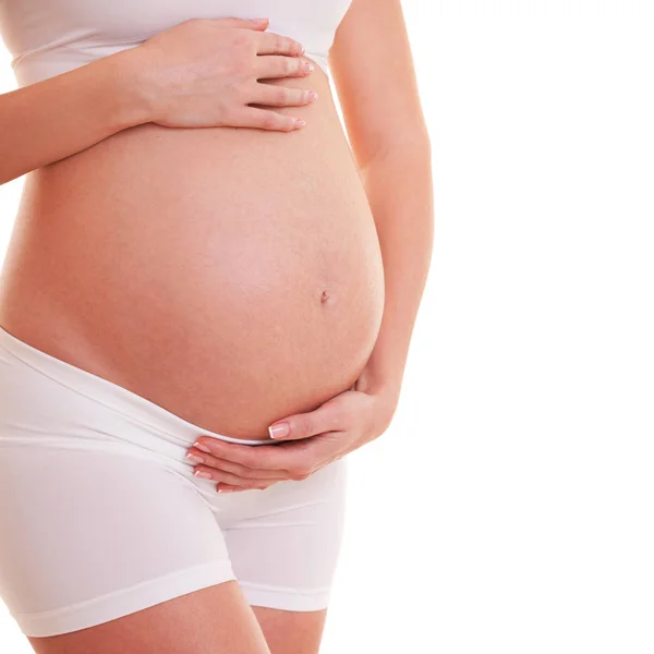 Afbeelding van de zwangere vrouw haar grote buik aan te raken. Close-up. Mooi lichaam van zwangere vrouw. Moederschap, zwangerschap, mensen en verwachting concept. Vrouw verwacht baby — Stockfoto