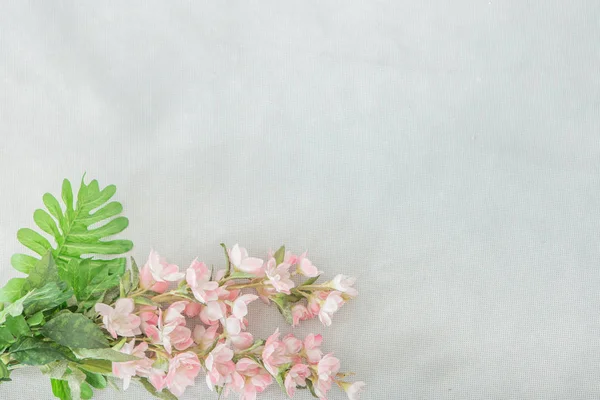 Pink flower bouquet In the corner of the white scene