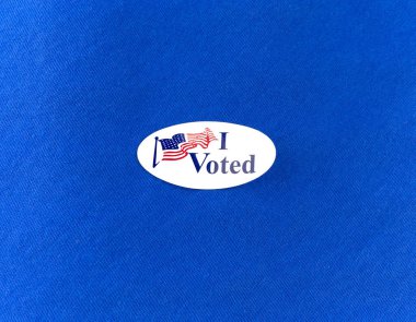 I Voted Election Sticker On Blue Cotton Shirt clipart