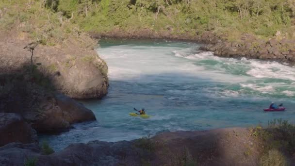 Kayakas on Petrohue falls at the surroundings of Osorno Volcano. Puerto Varas, Chile, South America. — Stock Video