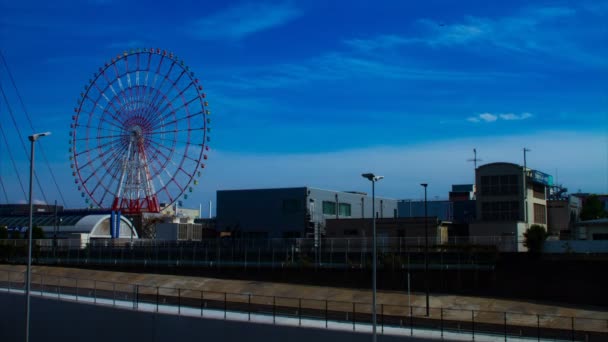 Ferris wheel behind the blue sky — Stock Video