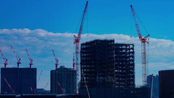 Moving cranes at the under construction time lapse — Stock Video