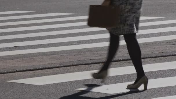 Walking people body parts at the crossing in the business town in Shinjuku Tokyo — Stock Video