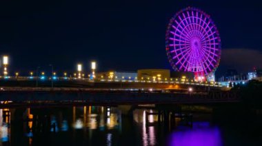 Odaiba Tokyo zaman atlamalı gece nehrin yakınında dönme dolabı