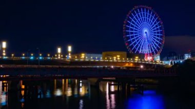 Odaiba Tokyo zaman atlamalı gece nehrin yakınında dönme dolabı