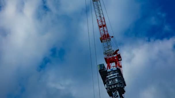Moving cranes timelapse behind the blue sky in Tokyo — Stock Video