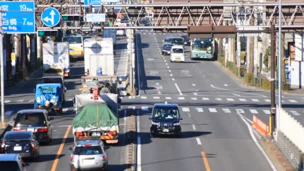 Rushing cars on the street at the downtown in Tokyo daytime — Stock Video