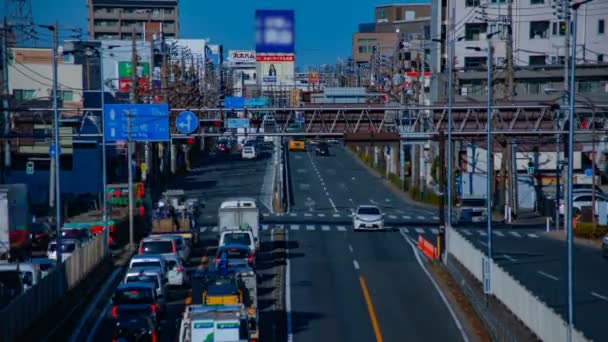 Rushing samochodów na ulicy w centrum Tokio w ciągu dnia timelapse środkowy strzał — Wideo stockowe