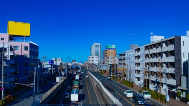 Rushing samochodów na ulicy w centrum Tokio w ciągu dnia timelapse szeroki strzał — Wideo stockowe