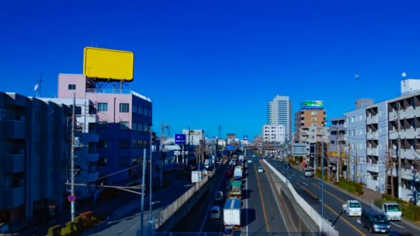 Auto in corsa per la strada del centro di Tokyo di giorno timelapse ampio colpo — Video Stock