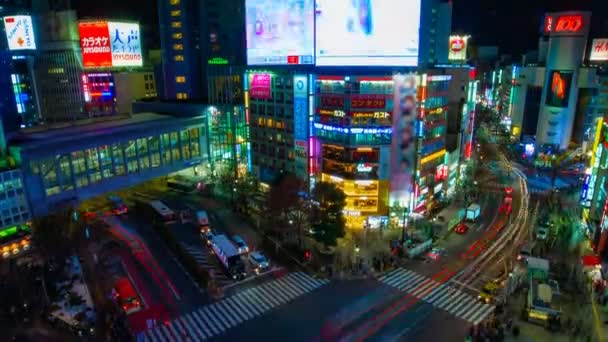 Cruce del timelapse nocturno en la ciudad de neón en Shibuya Tokio plano de gran angular — Vídeos de Stock