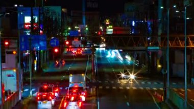 Tokyo şehir merkezinde sokak bir timelapse gece uzun pozlama orta çekim