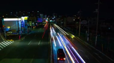 Tokyo şehir merkezinde sokak bir timelapse gece uzun pozlama geniş çekim