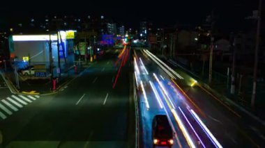 Tokyo şehir merkezinde sokak bir timelapse gece uzun pozlama geniş çekim